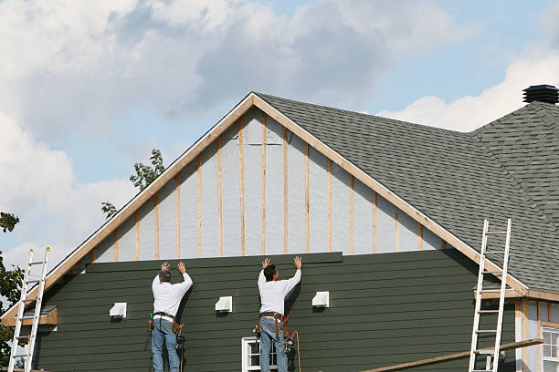 Professional Siding technician working in Stow, MA
